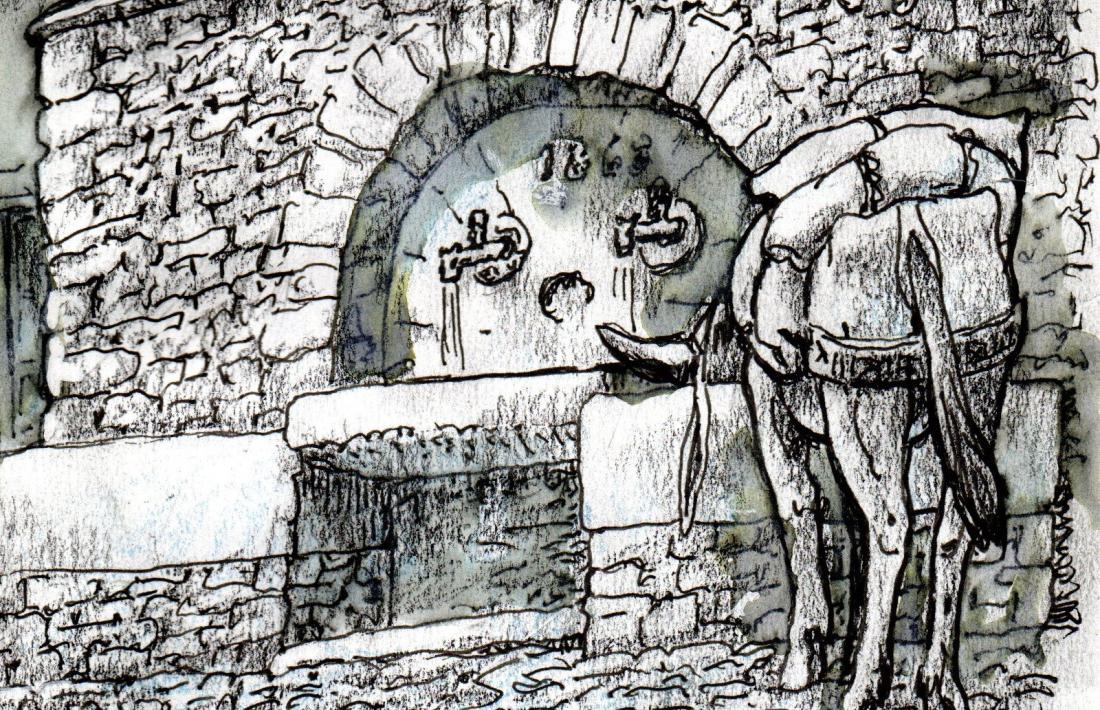 La font dels coms, amb dues aixetes i una pica entremig.