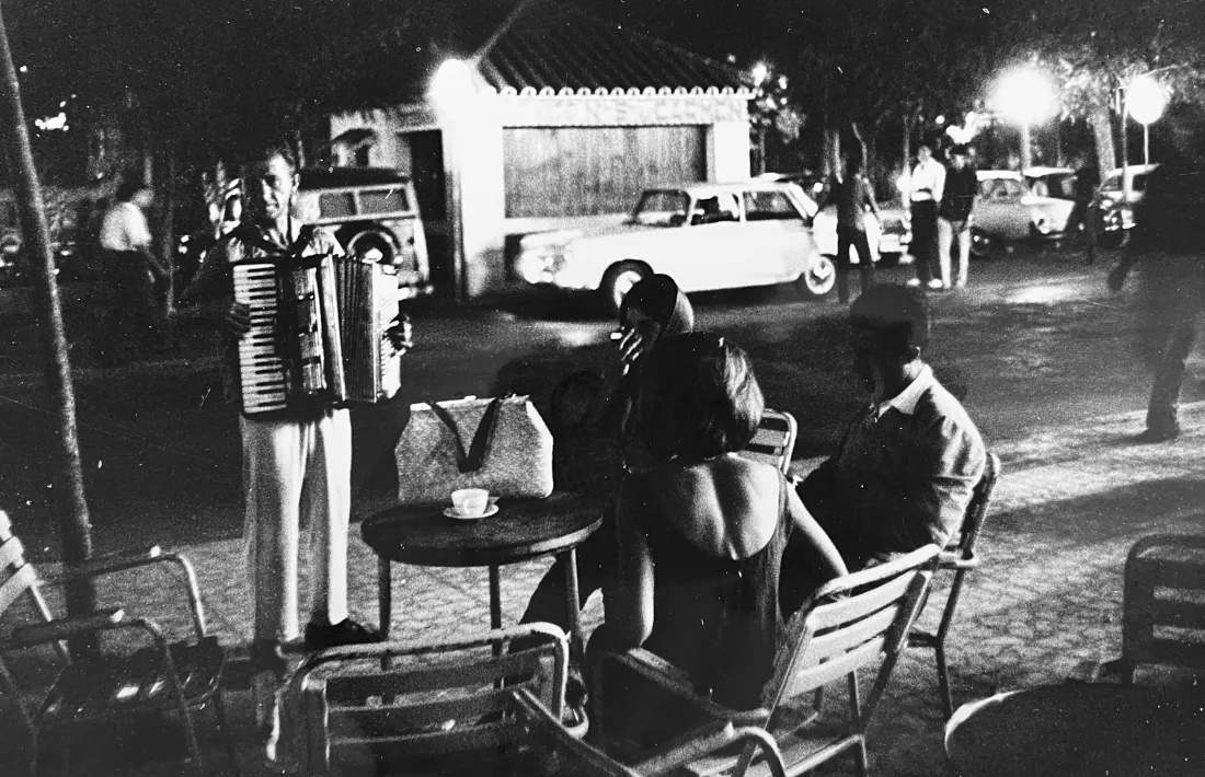 “It’s 2 a. m. and what is better than a cup of coffee in the open air after a session in one of the high clubs, with a street musicien to add romance?”
